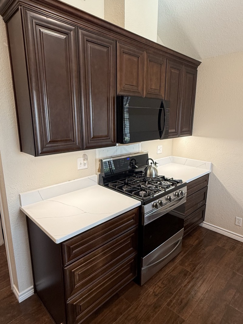 Espresso raised-panel kitchen cabinets