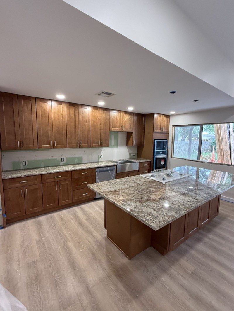 Open-plan maple kitchen with a large island in metro Atlanta