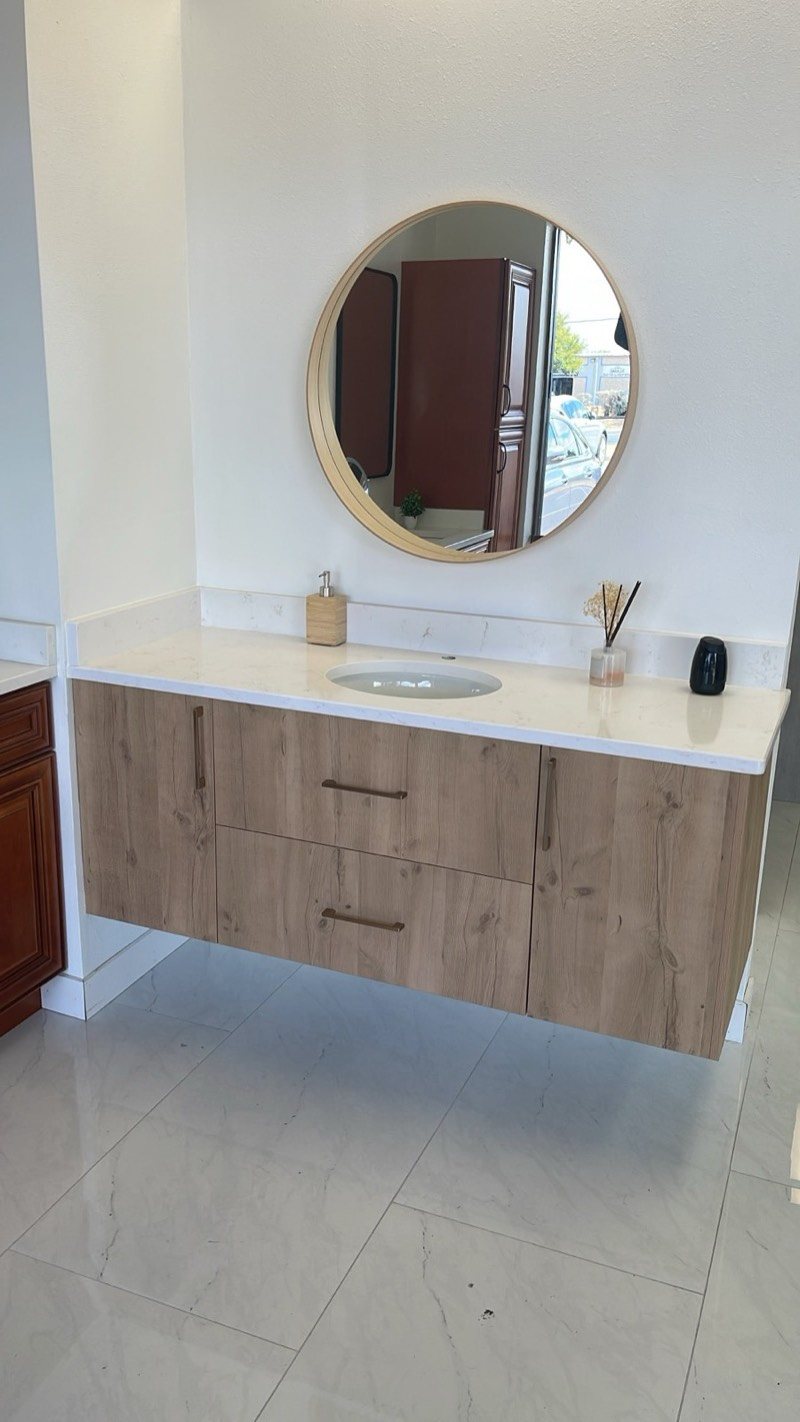 Floating wood-grain bathroom vanity cabinet with round mirror by MNK Cabinet